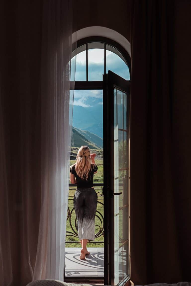 Jodie through a window in Kazbegi Georgia