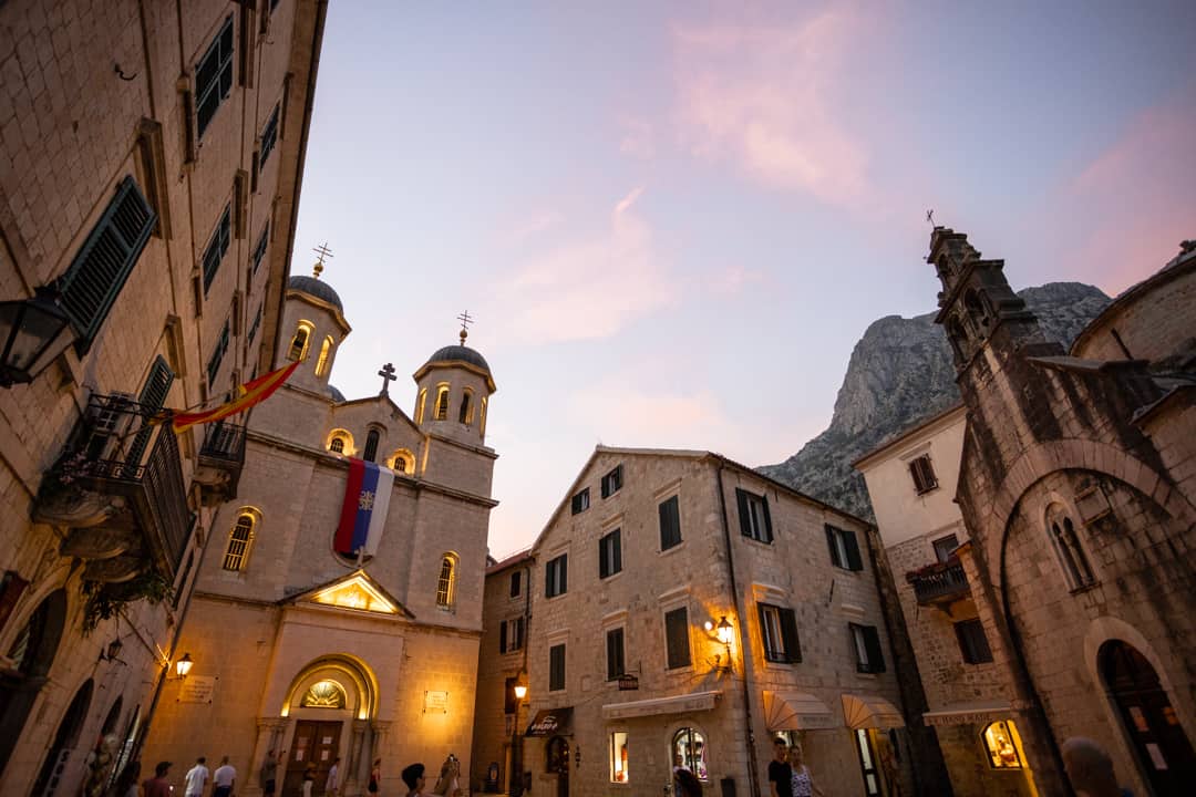 Why You Should Roadtrip Montenegro (+ Montenegro Road Trip Guide) 3 Buildings in the Old Town of Kotor at sunset