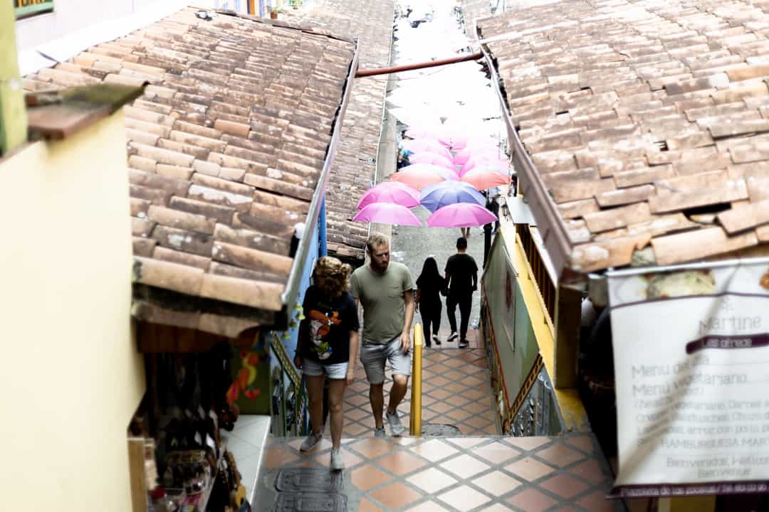 Colombia 5 Tourists walking up steps in Guatapé Colombia