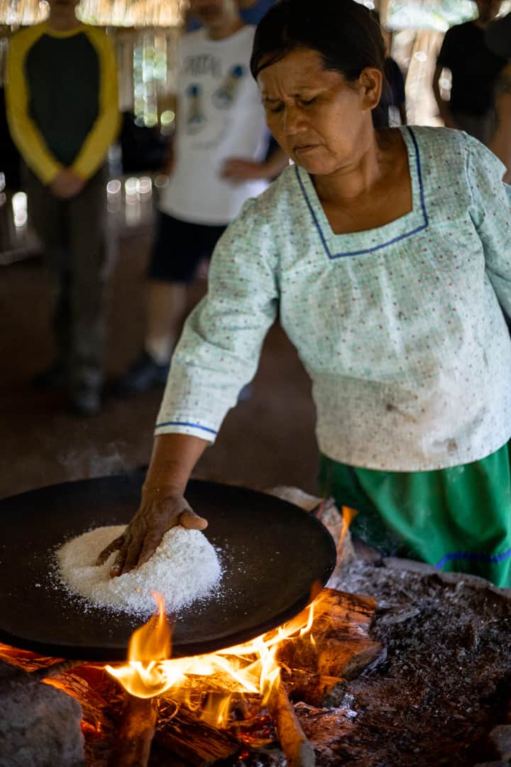 A woman cooking in the Amazon Rainforest in Ecuador