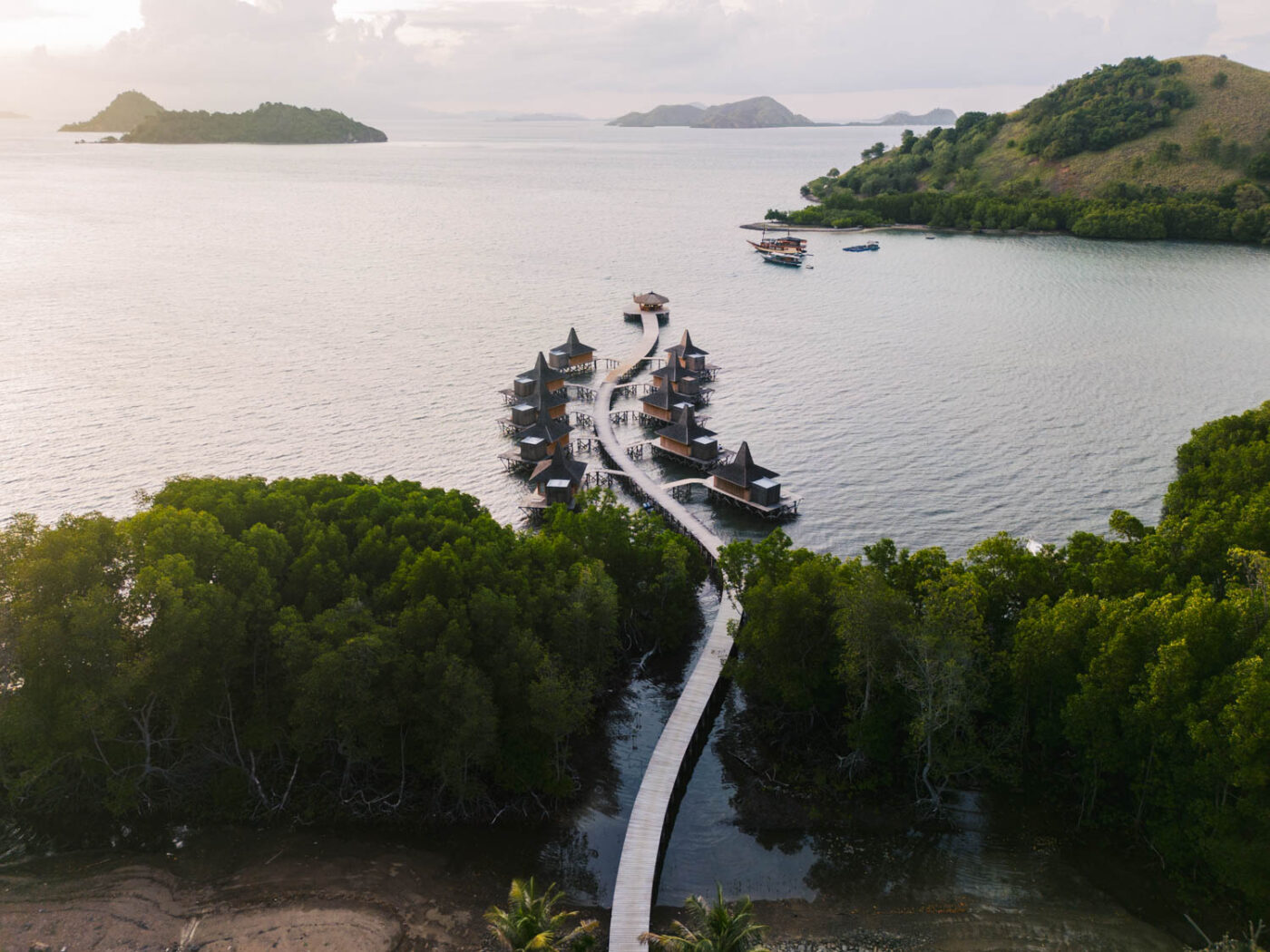 Aerial view looking over the sea suites at Menjaga Bay and out onto the bar and surrounding islands at the end.