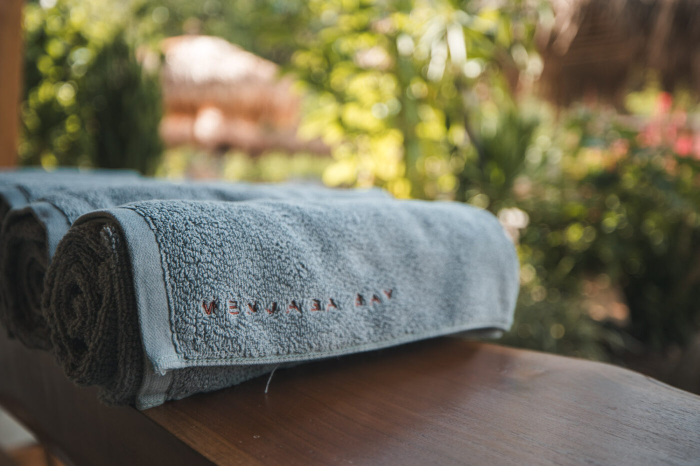 Studio Alajode: Where story meets strategy | Travel Marketing & Media Services 42 Rolled up towel with Menjaga Bay embroidered on it