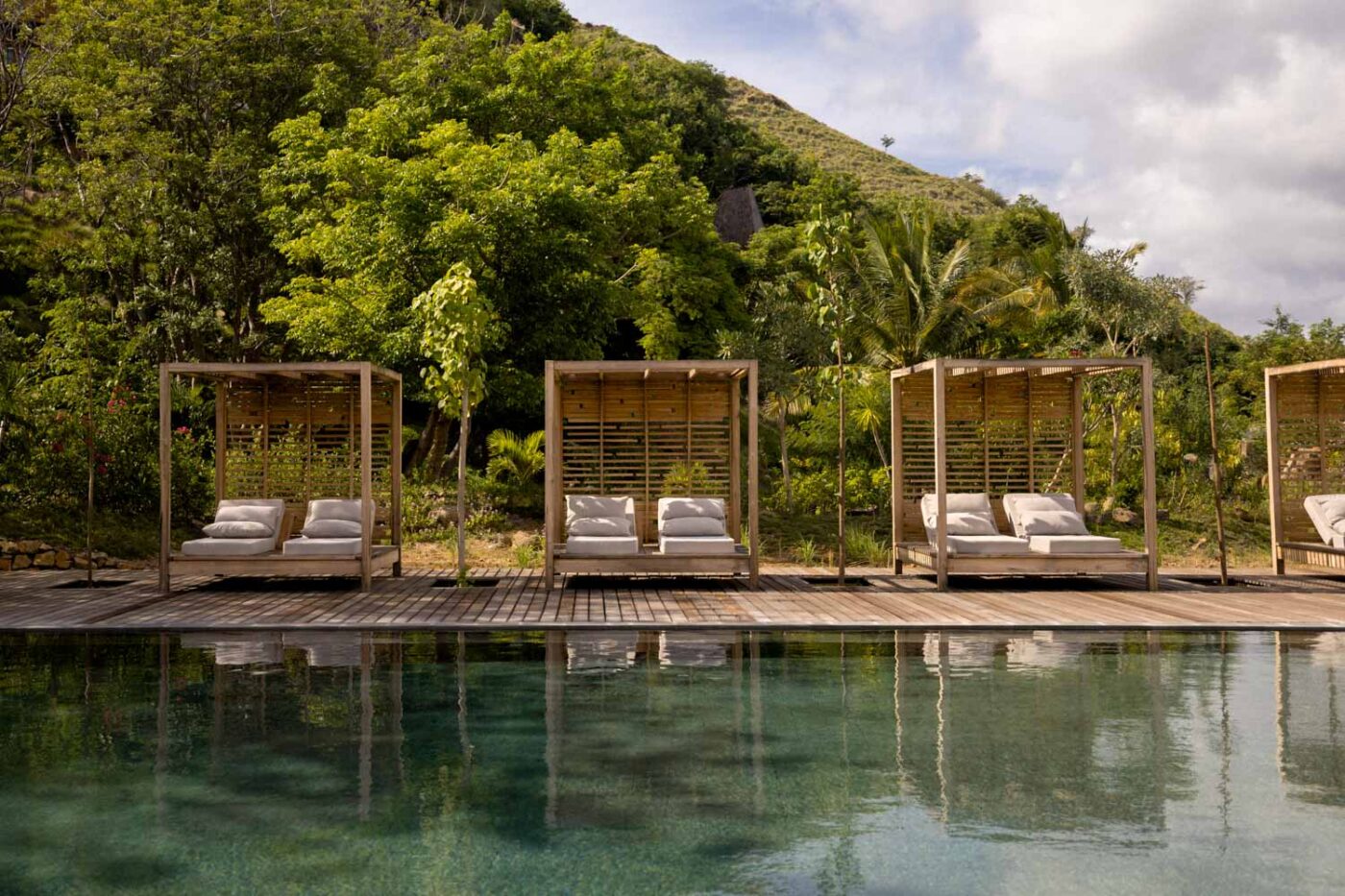Studio Alajode: Where story meets strategy | Travel Marketing & Media Services 40 Double sunbeds next to a very still pool