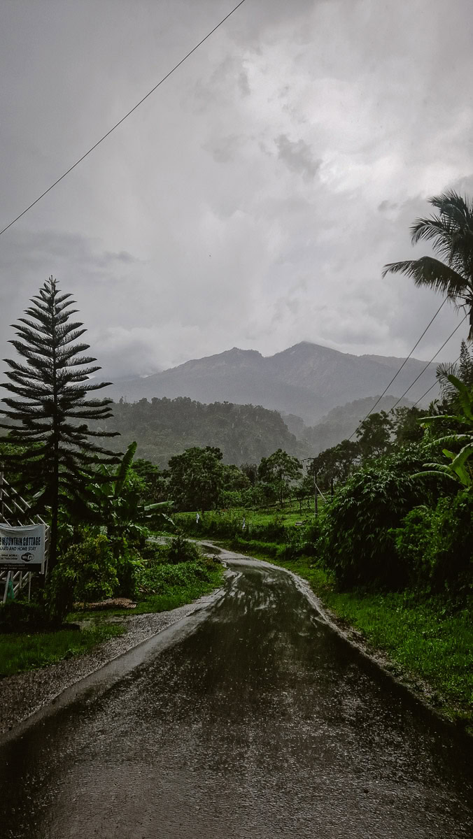 Visiting the Senaru Waterfalls in Lombok: A Complete Guide For Nature Lovers 7 A road in Senaru, Lombok, with mountains in the background