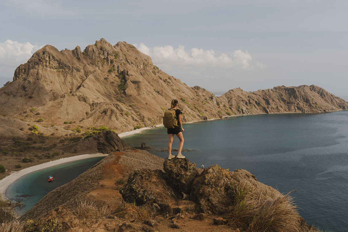Planning A Komodo Island Day Trip: Tips & Warnings For Booking A Boat Tour Of Komodo Island, Indonesia 2 Jodie taking photos from a viewpoint on Padar Island