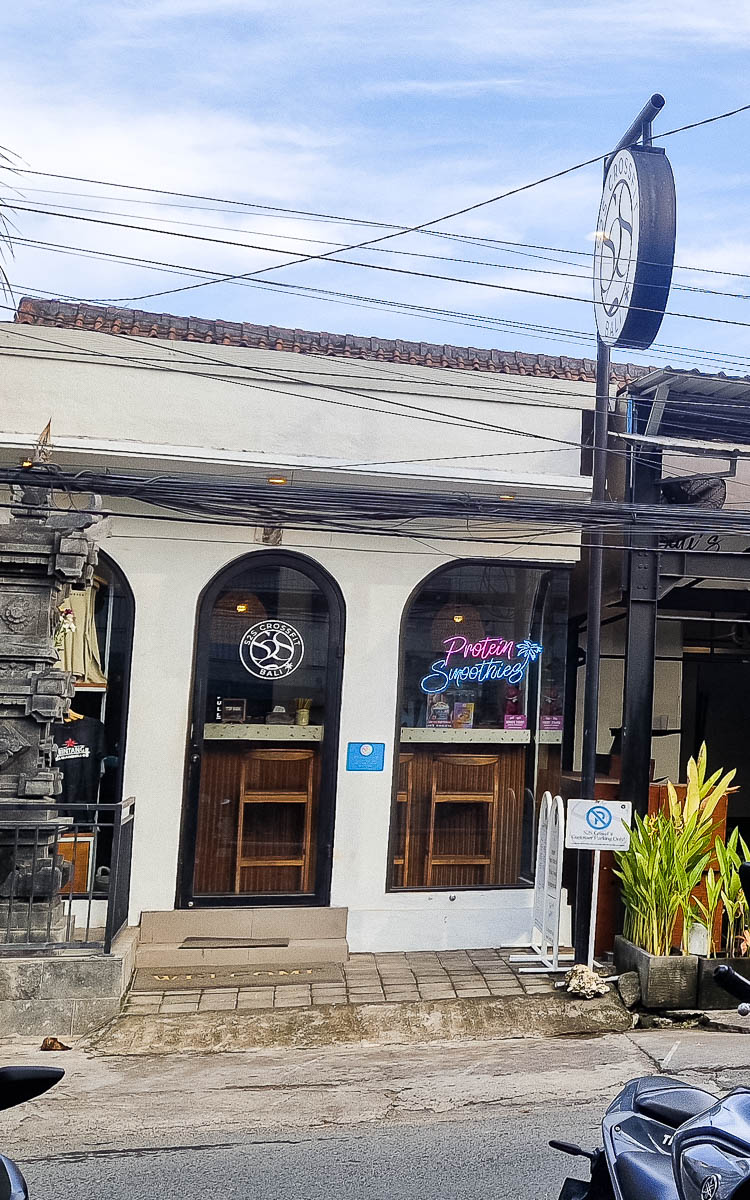 Vegan Canggu: A tried-and-tested guide to vegan cafes & restaurants in Bali's digital nomad hotspot 18 Exterior of S2S CrossFit in Canggu Bali. There is a neon sign advertising protein smoothies.