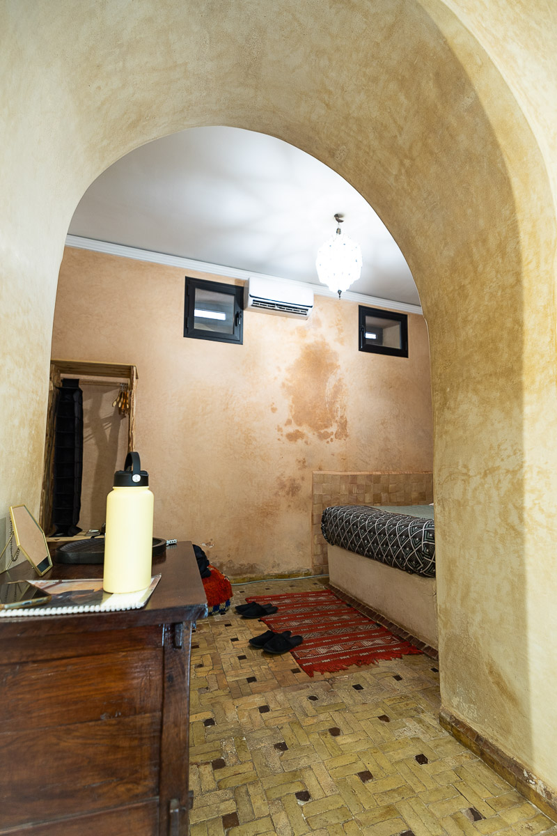 Riad Bamileke (Medina Marrakech): Complete Review & FREE Morocco Travel Guide 5 An archway in the centre of a riad room in Marrakech