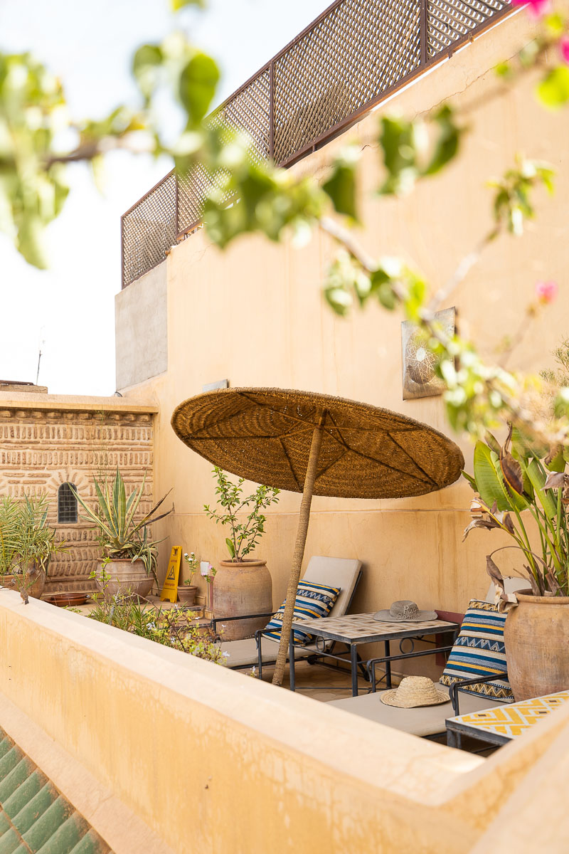 Riad Bamileke (Medina Marrakech): Complete Review & FREE Morocco Travel Guide 2 Rooftop with an umbrella and two sun loungers at Riad Bamileke in Marrakech Medina