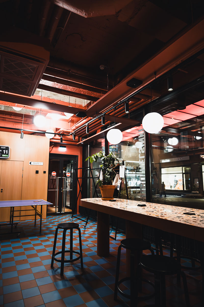 Hobo Hotel Helsinki: A Charmingly Quirky Boutique Hotel in Helsinki, Finland 15 Common area with ping pong table and co-working space at Hobo Hotel Helsinki Finland